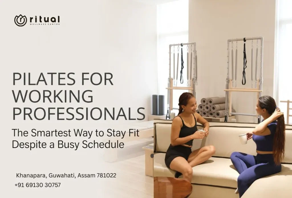 Two working professionals discussing their Pilates workout session in a modern Pilates studio in Guwahati.